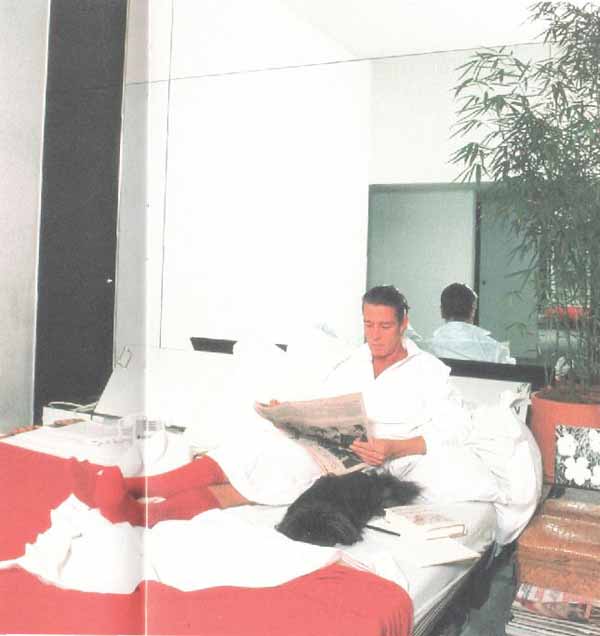 Halston-in-bed-with-pekingese-dog-linda